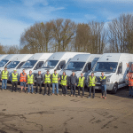 fleet of vans in the background with drivers stood in front for any driver fleet insurance