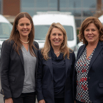 three vans in the background with office and three workers in the front, fleet insurance for small businesses